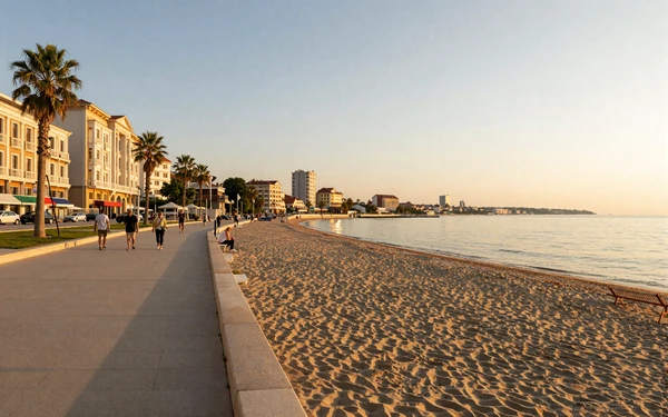 Varna, Bulgaria seaside promenade along the Black Sea coast at sunset with golden light