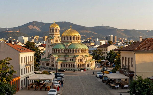 Sofia, Bulgaria city center with Alexander Nevsky Cathedral and Vitosha Mountain at golden hour